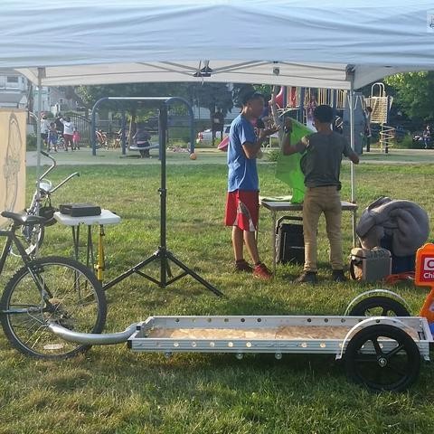 photo of  empty bicycle trailer in front of canopy prior to event