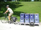 64A bicycle trailer carrying 8 bins of mulch