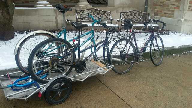 bike pulling trailer with two bikes in fork mount rack